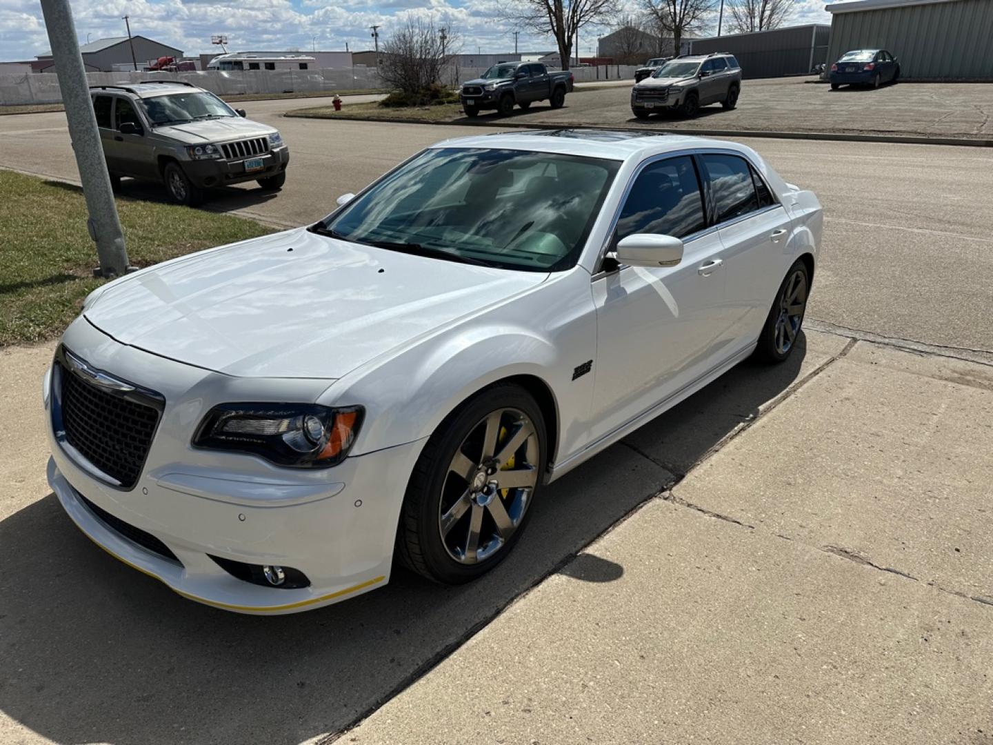 2012 WHITE CHRYSLER 300 SRT-8 (2C3CCAFJ5CH) with an 6.4L engine, Automatic transmission, located at 1030 S. 22nd St., Bismarck, ND, 58504, (701) 258-0022, 46.793560, -100.758118 - 6.4 Liter SRT-8 YELLOW BRAKE CALIBER COVERS-AUTO- Photo#0