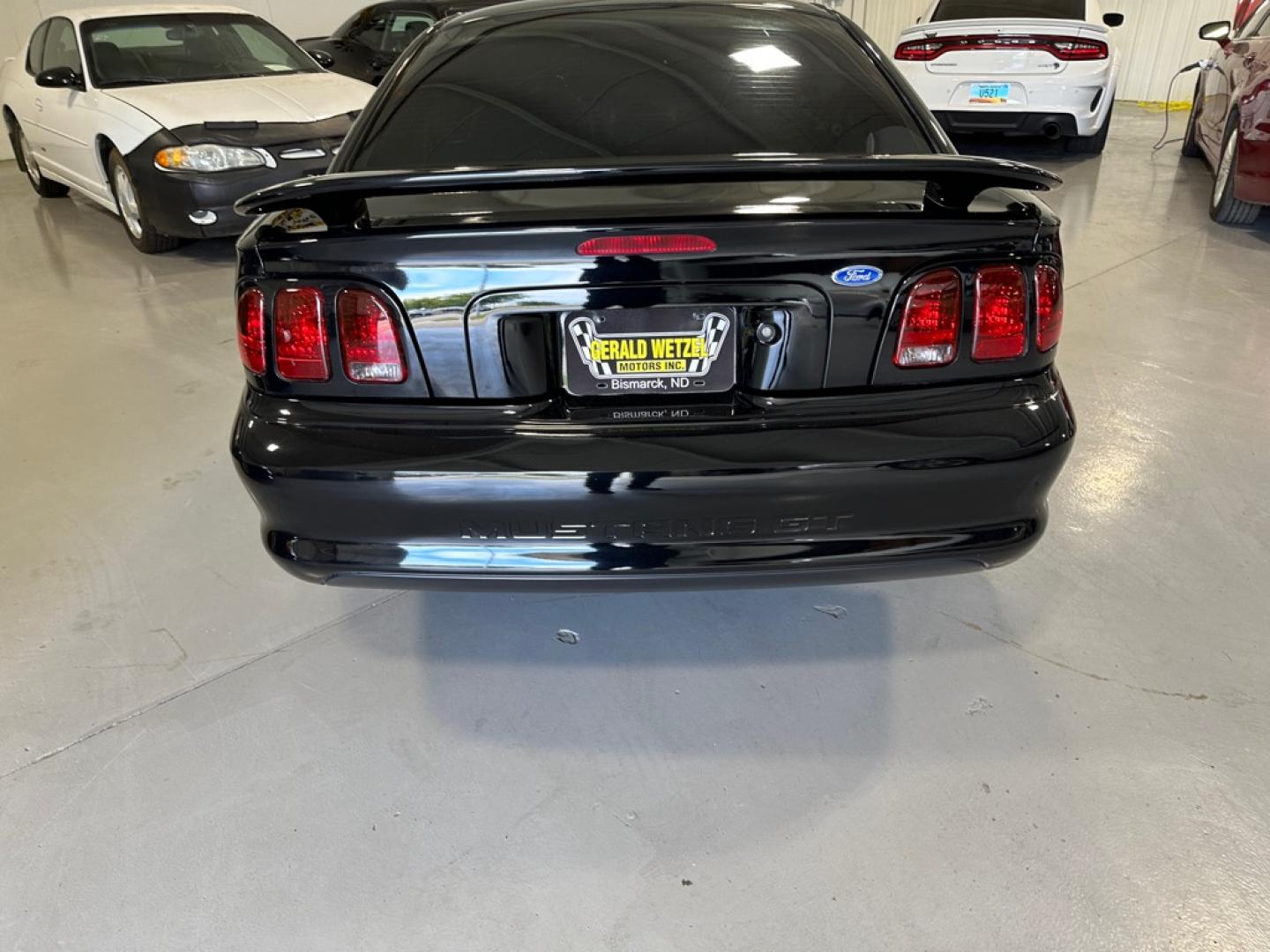 1996 BLACK FORD MUSTANG GT (1FALP42X5TF) with an 4.6L engine, Automatic transmission, located at 1030 S. 22nd St., Bismarck, ND, 58504, (701) 258-0022, 46.793560, -100.758118 - 4.6 LITER, AUTO, BLACK BULLET WHEELS, BLORA SIDE EXHAUSR, 35OOO ACTUAL MILES, LIKE NEW- Photo#2