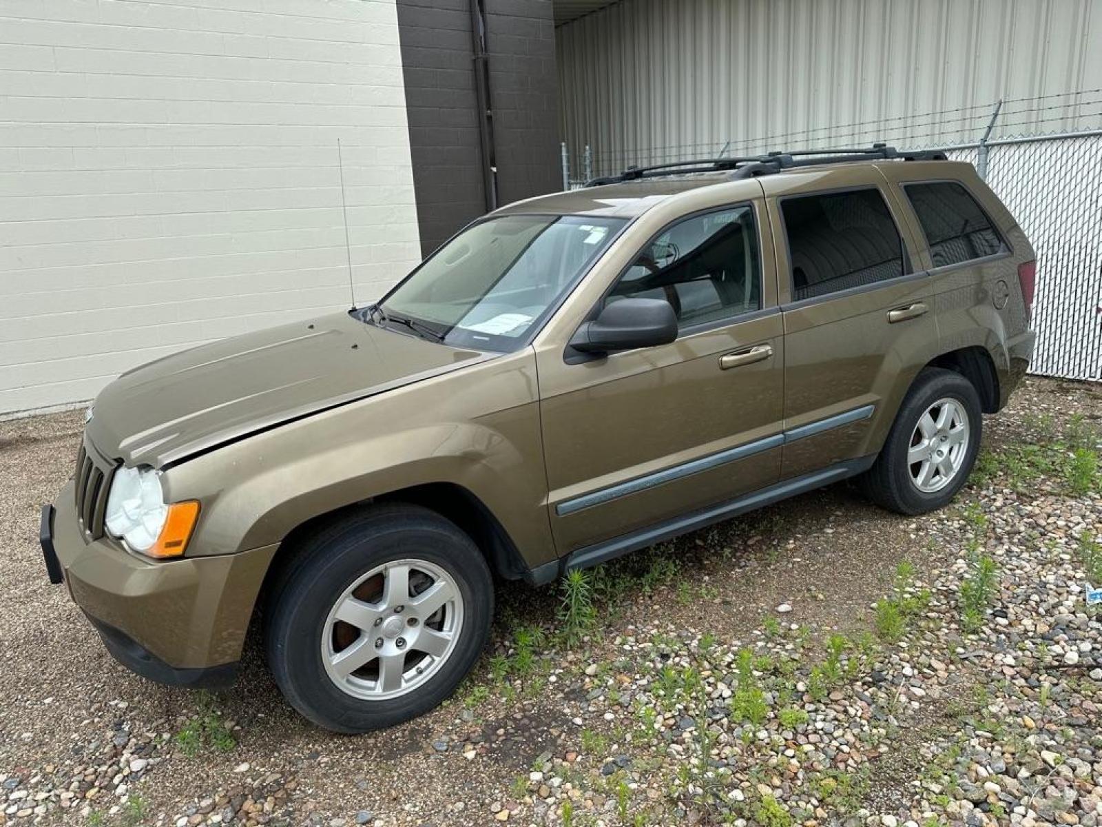 2009 OLIVE JEEP GRAND CHEROKEE LAREDO (1J8GR48K69C) with an 3.7L engine, Automatic transmission, located at 1030 S. 22nd St., Bismarck, ND, 58504, (701) 258-0022, 46.793560, -100.758118 - ENGINE REPLACEMENT 91000 MILES - Photo #0