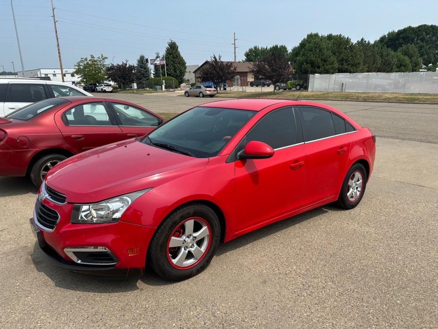 2015 RED CHEVROLET CRUZE LT (1G1PC5SB6F7) with an 1.4L engine, Automatic transmission, located at 1030 S. 22nd St., Bismarck, ND, 58504, (701) 258-0022, 46.793560, -100.758118 - NICE CLEAN CRUZE- Photo#0