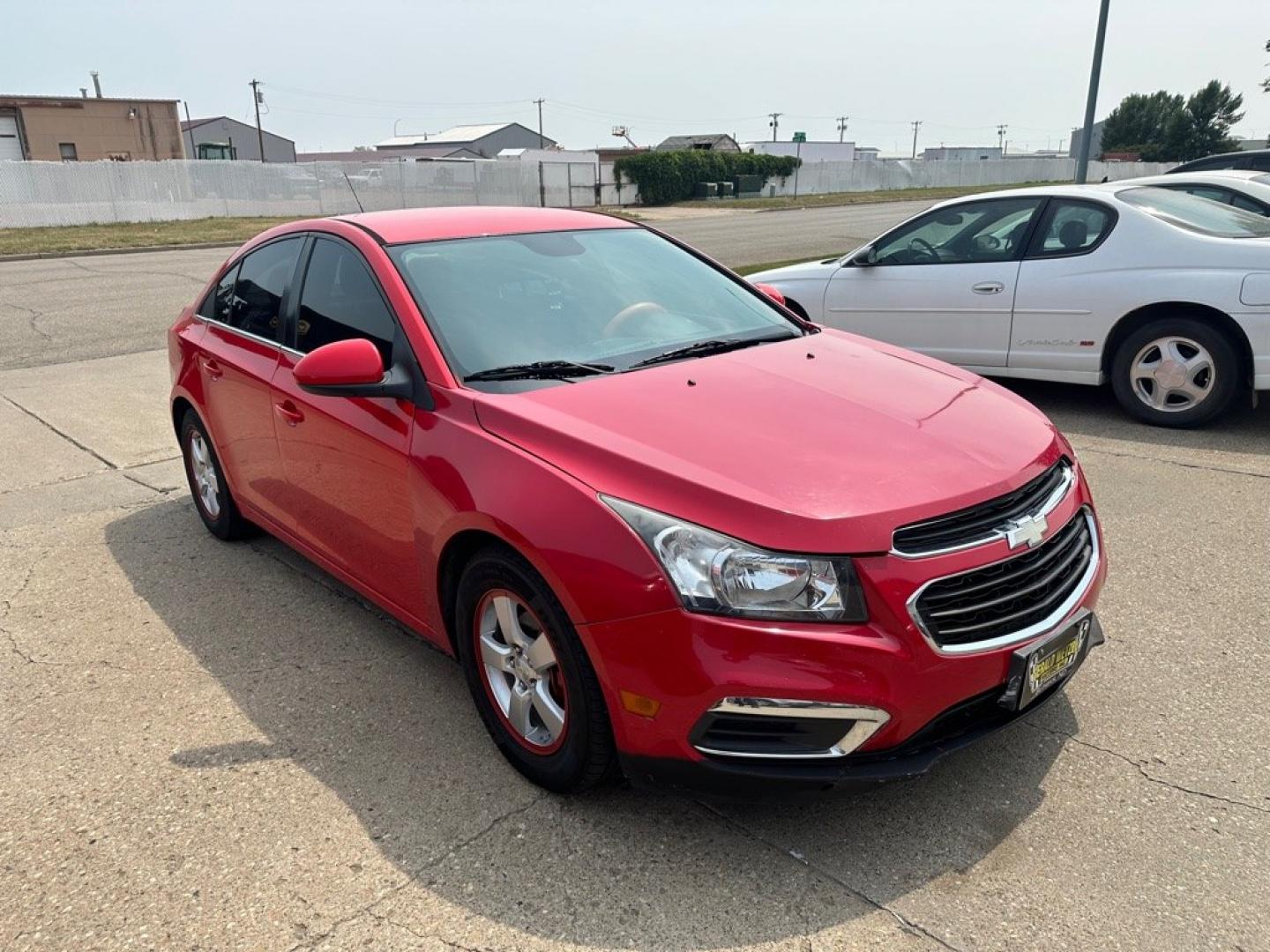 2015 RED CHEVROLET CRUZE LT (1G1PC5SB6F7) with an 1.4L engine, Automatic transmission, located at 1030 S. 22nd St., Bismarck, ND, 58504, (701) 258-0022, 46.793560, -100.758118 - NICE CLEAN CRUZE- Photo#1